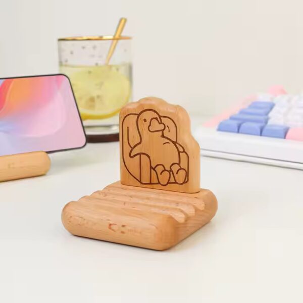 Phone wood holder featuring a cute animal design. Customizable phone wood holder.