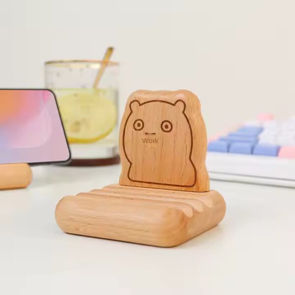 Cute wooden phone holder featuring an animal design. Customizable phone wood holder for wholesale.