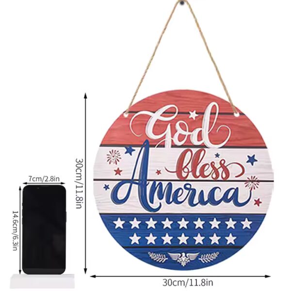 Round wooden God Bless America sign with red, white, and blue patriotic design.
