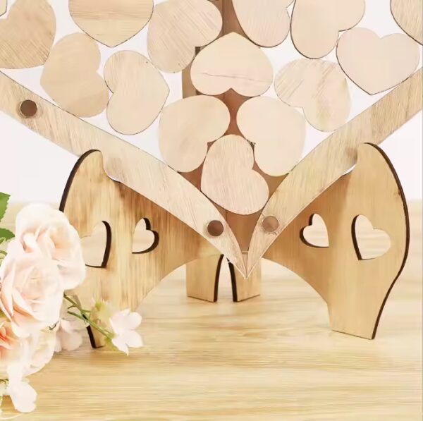 Wooden heart wedding guest book with stand. Wholesale supplier of heart shaped wedding decor.