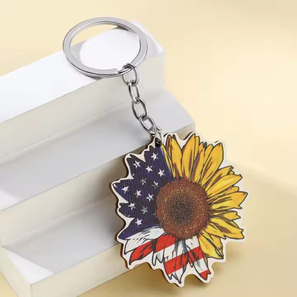 Wooden sunflower keychain with USA flag design. Patriotic keychain.