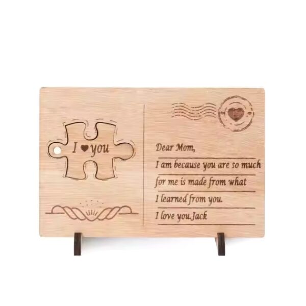 Engraved wood key holder postcard with "I love you" and a puzzle piece, a personalized gift from Jack to Mom.