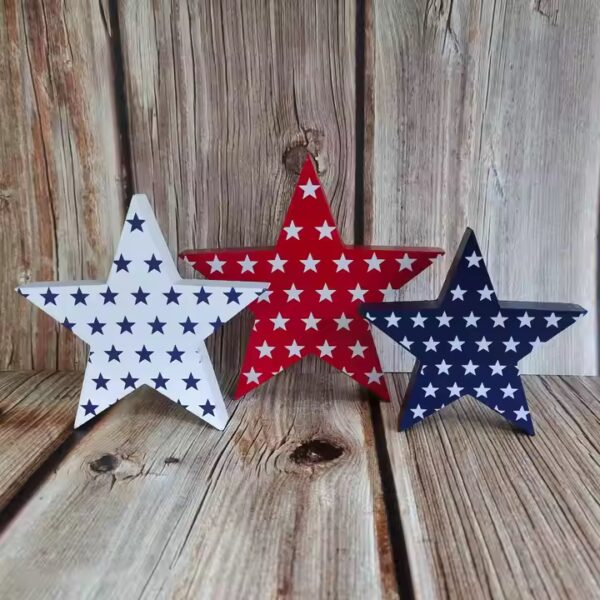 Three patriotic wooden stars, red, white, and blue, on a wood background. Custom wooden crafts.