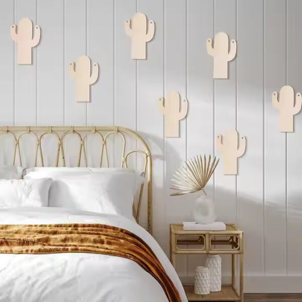 Wooden cactus wall decor in a bedroom. Wholesale cactus decorations available.